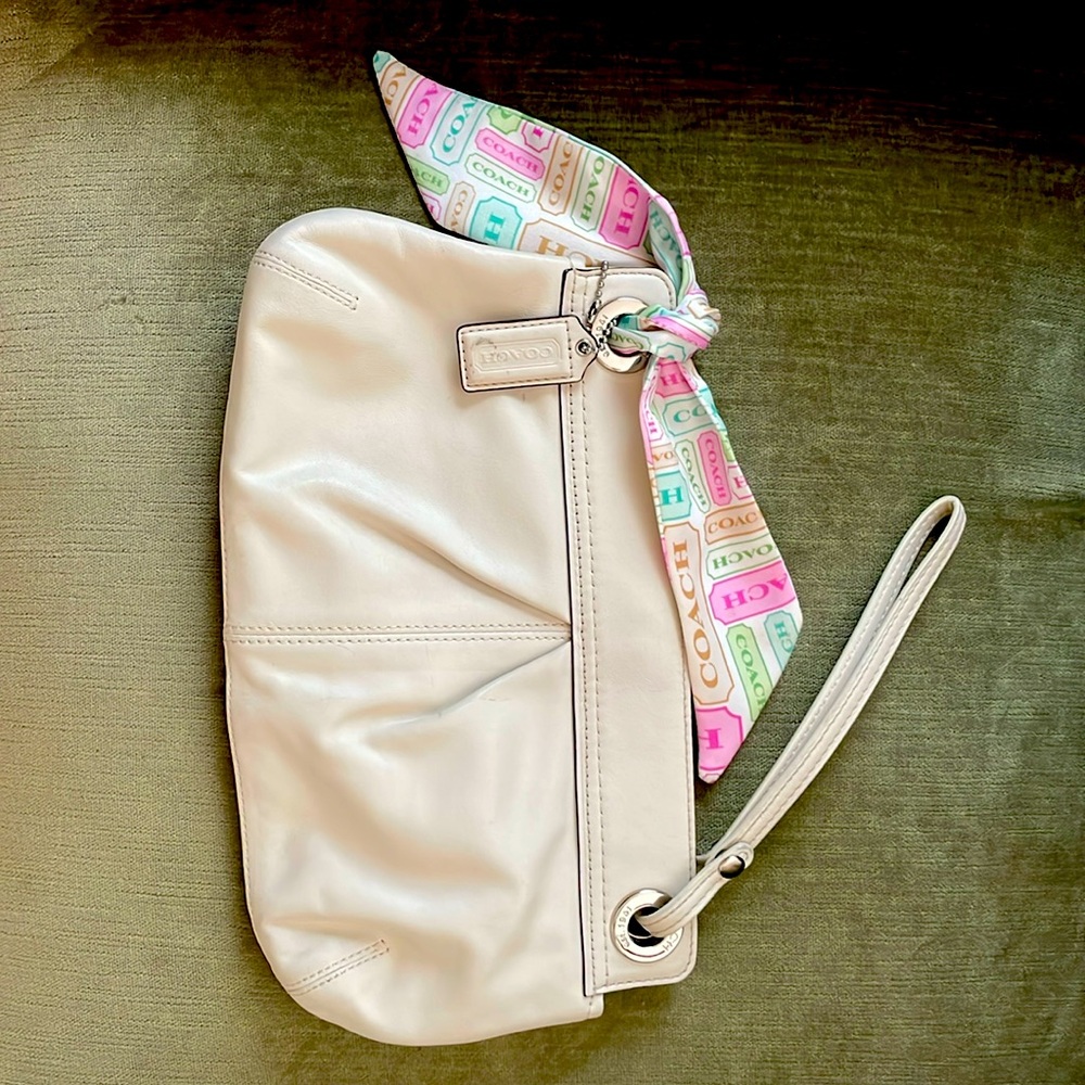 Coach clutch in winter white. Includes decorative mini scarf